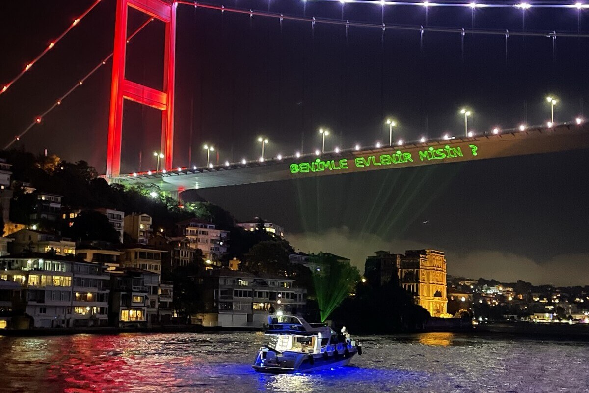 Writing Marriage Proposal Lyrics with Laser on the Bosphorus Bridge